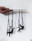 Steel decorative gift item featuring a couple each on a swing