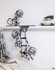 Steel decorative gift item featuring four elves hanging from a ladder